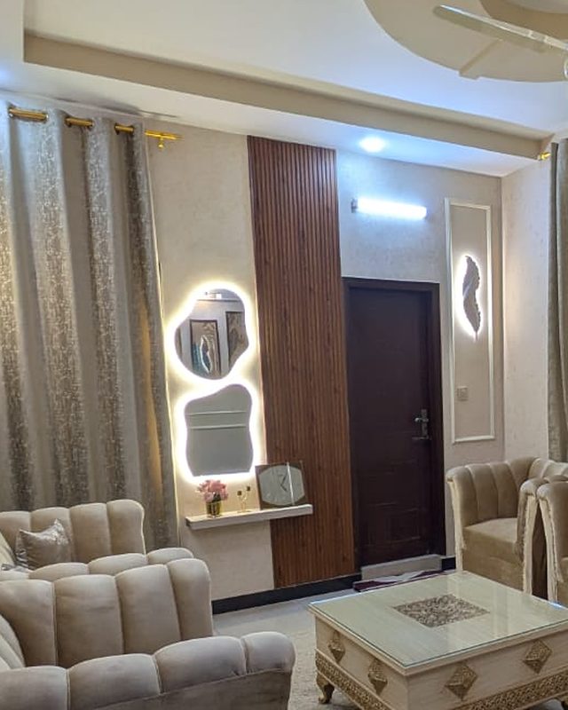 Lounge after: Lounge makeover: panelling, wooden slats & lighting