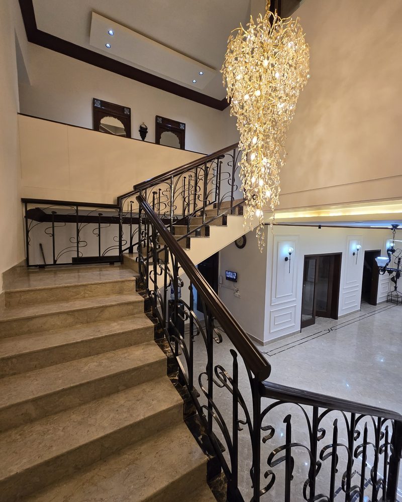 Staircase and entrance after: Staircase & entrance: marble, railing & chandelier